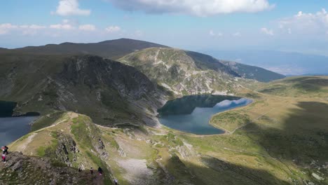 Tourist-People-enjoy-View-at-Seven-Rila-Lakes-Hike-Trail-in-Bulgaria---Aerial-4k