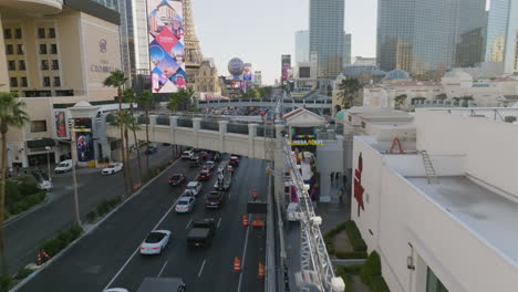 Aerial-view-following-the-Strip,-Las-Vegas-Boulevard,-golden-hour-in-Nevada,-USA