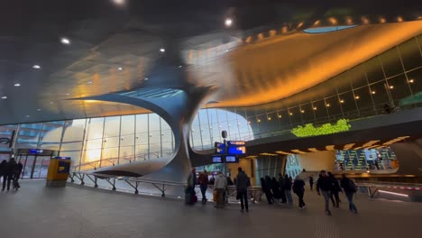 Arnhem-Central-Station-futuristic-interior-with-passengers-wide-total-shot