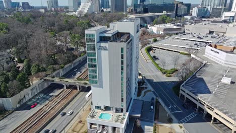 Aerial-orbit-shot-of-luxury-Hyatt-Centric-Buckhead-Hotel-in-Atlanta-City-during-daytime,-USA