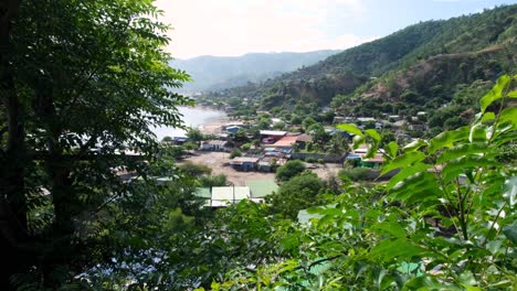 A-glimpse-of-local-community-houses-at-Tasitolu-wetlands-saline-lakes-in-the-capital-city-of-East-Timor,-Southeast-Asia