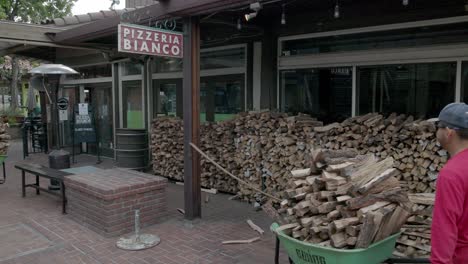 Wood-being-delivered-outside-to-Pizzeria-Bianco-Town-and-County-in-Phoenix,-Arizona