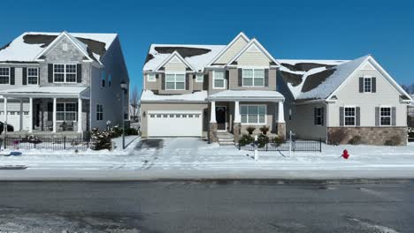 Mercedes-driving-on-icy-street-of-american-neighborhood-in-winter