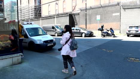 Woman-walking-on-Dublin-street-by-Panda-Restaurant-to-have-lunch