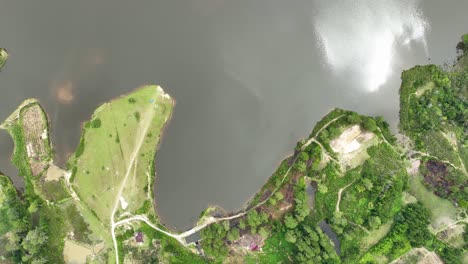 Birdseye-view-of-calm-still-water-of-Pea-Aeknetonang-lake,-Samosir-Island