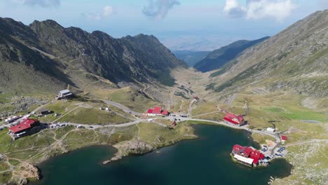 Transfaragasan-Mountain-Road-Pass-and-Lake-Balea-in-Carpathians,-Transylvania,-Romania---Aerial-4k-Circling