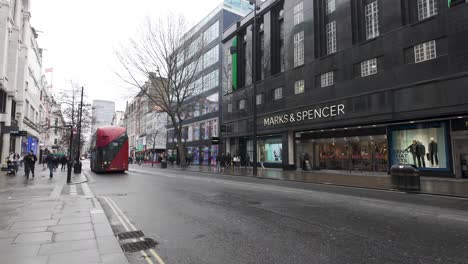 Red-Double-Decker-Buses-Going-Past-On-Overcast-Day-On-Oxford-Street