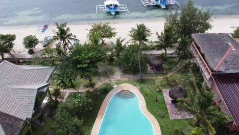 Tropical-beach-house-with-green-garden-and-swimming-pool