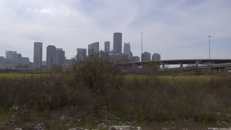 Drone-shot-of-downtown-Houston,-Texas-on-a-high-contrast-sunny-day