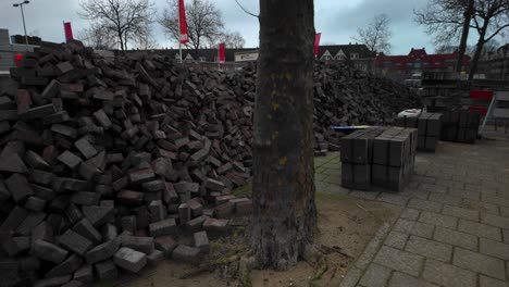 Pile-of-brick-stones-on-public-street-in-Vogelbuurt-Amsterdam-Noord-for-reconstruction