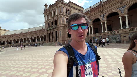 Traveler-vlogging-in-Plaza-de-España,-walking-with-girlfriend