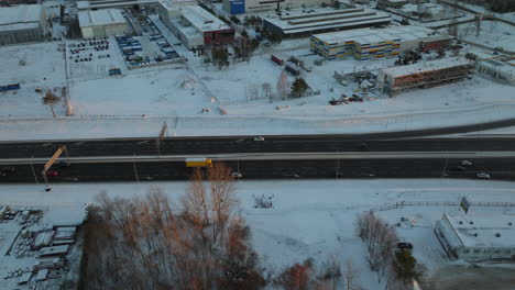 Aerial-top-down-of-cars-on-highway-at-winter-snow