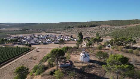 Aerial-of-the-La-Ermita-del-Poblado-de-San-Julián,-an-esteemed-sanctuary-inviting-pilgrims-and-visitors-to-immerse-themselves-in-its-serene-ambiance