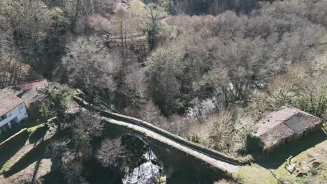 Roman-bridge-along-Antonino's-Via-Nova-the-esteemed-Navea-Bridge,-aerial-overview