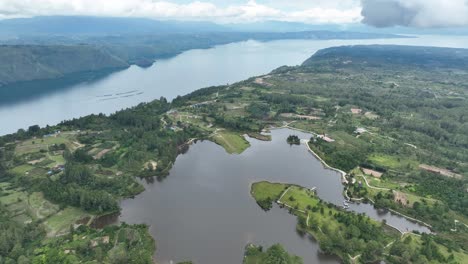 Picturesque-Pea-Aeknetonang-lake,-Samosir-Island,-Indonesia.-Aerial