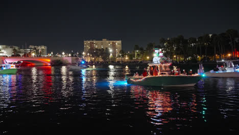 Boats-Floating-on-River-at-Christmas-Boat-Parade-in-Tampa-Bay,-Florida