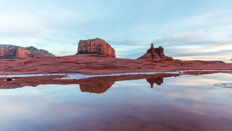 Courthouse-Butte-And-Bell-Rock-Reflections-On-Puddle-Of-Water