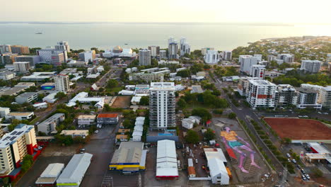 Aerial-drone-of-with-Large-Human-Painting-at-Sunset-on-Coast-of-Darwin-Central-Business-District-Australia