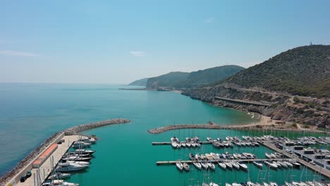 Drone-flies-over-Ginesta-port-on-Garraf-coast-in-summer