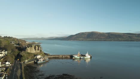 Carlingford-castle-and-harbor-in-county-louth,-ireland-at-sunrise,-aerial-view