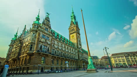 Golden-hour-at-the-historic-Hamburg-Town-Hall-with-clear-skies-and-a-bustling-square,-timelapse