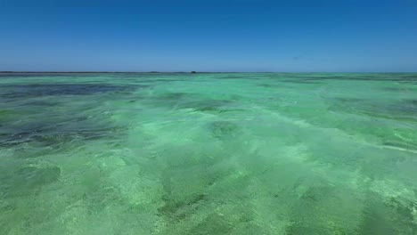 Pov-Sail-on-crystal-clear-Turquoise-Caribbean-Sea,-water-texture-concept