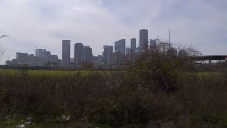 Drone-shot-of-downtown-Houston,-Texas-on-a-high-contrast-sunny-day