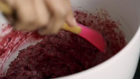 Mixing-up-red-beet-muffin-batter-inside-a-white-bowl-brownie-chocolate-cake-batter-valentine's-day