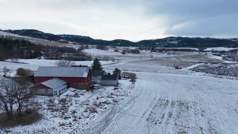 Remote-Structures-Overlooking-Mountain-Ridges-In-Winter-Season-In-Norway