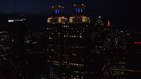 Drone-shot-of-Atlanta-Georgia-famous-skyscrapers-and-cityscape-at-night