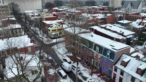 USPS-delivery-mail-van-driving-on-urban-street-in-USA-city-after-snow-storm