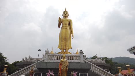 Giant-Gold-Standing-Buddha-Statue,-Outdoor