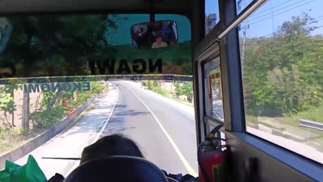 Pov-from-inside-a-bus-heading-to-Ngawi-from-Blora,-Central-Java,-in-Indonesia