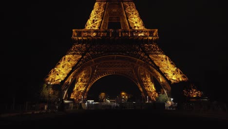 Base-of-Eiffel-Tower-at-Night-in-Champ-de-Mars