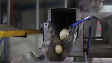 POV-SHOTS-IN-CAMERA-Potatoes-are-being-washed-and-processed-into-chips