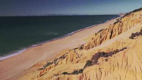 Flying-Above-Rock-Formations-On-The-Shore-Of-Gale-Beach-In-Algarve,-Portugal