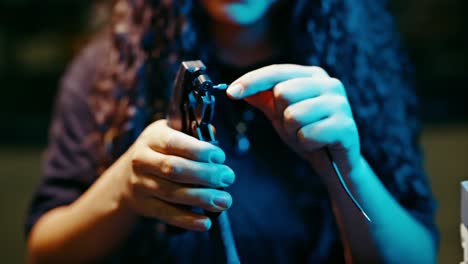 Close-up-view-of-young-woman-hands-,-repairing