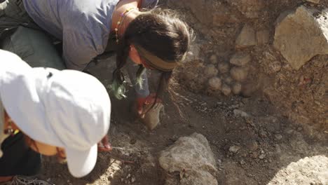 Close-up-of-two-archaeologists-during-excavation-in-Greece