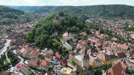 Sighisoara-Old-Town-and-Churches-in-Transylvania,-Romania---Aerial-4k