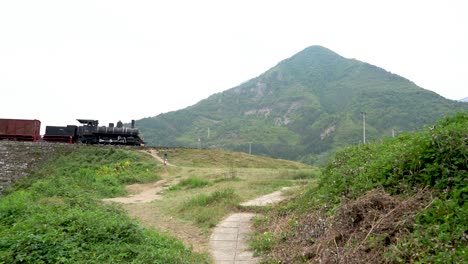 Train-in-bosnia-and-herzegovina-bosnian-train-cars-on-hill-stock-footage