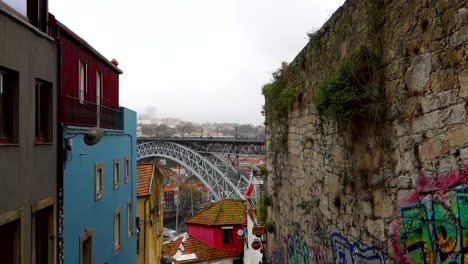 Ponte-Dom-Luis-I-seen-through-an-alley-on-a-cloudy-day-with-fog