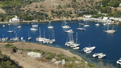 Yachts-And-Sailboats-Floating-In-The-Blue-Sea-In-Summer-In-Gumusluk,-Turkey