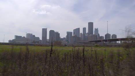 Drone-shot-of-downtown-Houston,-Texas-on-a-high-contrast-sunny-day