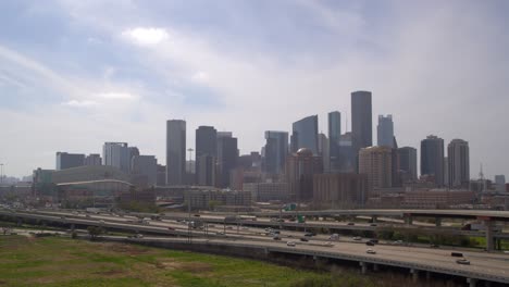 Drone-shot-of-downtown-Houston,-Texas-on-a-high-contrast-sunny-day