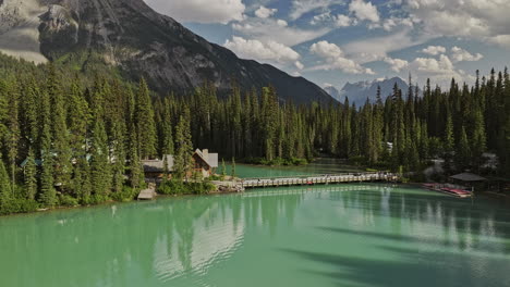 Emerald-Lake-BC-Canada-Aerial-v8-flyover-lakeside-lodge-at-Yoho-National-Park,-capturing-calm-waters-and-coniferous-forests-surrounded-by-mountain-ranges---Shot-with-Mavic-3-Pro-Cine---July-2023