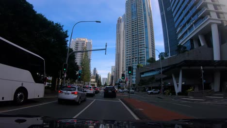Point-of-view-driving-North-through-Surfers-Paradise-on-the-Gold-Coast-Highway,-Gold-Coast