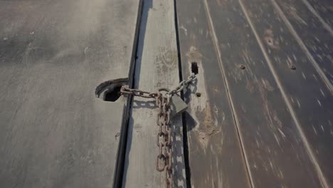 Chained-door-of-a-house-built-with-volcanic-rocks