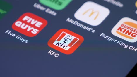 Swiping-on-smartphone-to-KFC-Kentucky-Fried-Chicken-app