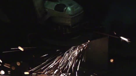 Angle-Grinder-Cutting-Metal-with-Sparks-Flying-in-Slow-Motion-in-a-Factory