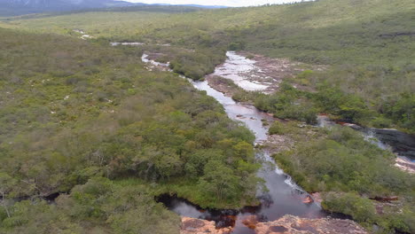 View-of-a-small-river-cutting-the-vegetation,-Chapada-Diamantina,-Bahia,-Brazil